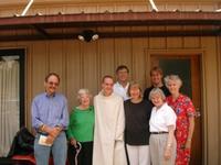 Nick, newly ordained, poses with family